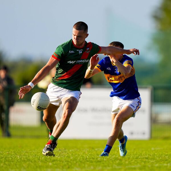 Joe Dunne strikes the ball to raise a green flag for Milltown. Photo: James Lawlor.
