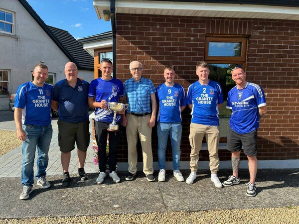 Some of the Castle Villa squad present the Division 2 trophy to Club President, Tommy O'Connell. 