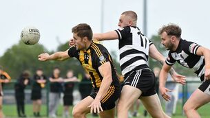 <p>Mark Byrne (Round Towers) and Robbie Lee (Kilcullen) contest possession Photo: Michael Anderson</p> <p>Mark Byrne (Round Towers) and Robbie Lee (Kilcullen) contest possession Photo: Michael Anderson</p>