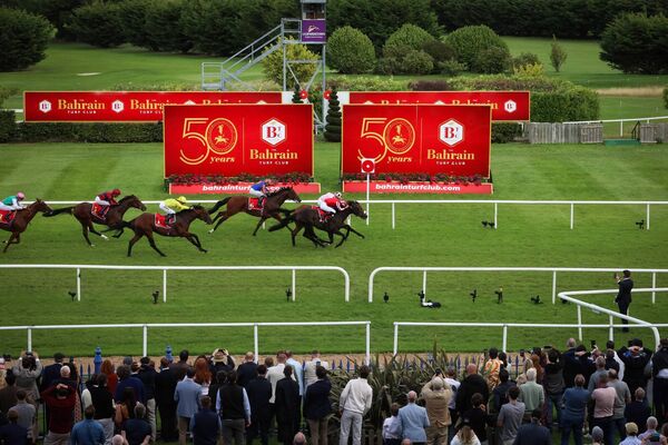  Shane Foley (pink silks) onboard Hotazhell comes home to win ahead of Christophe Soumillon (red silks) onboard Wimbledon Hawkeye in a photo finish