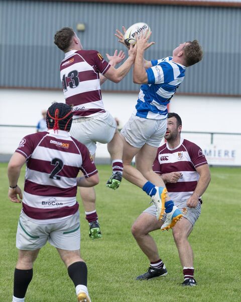 Athy's Jack Henry takes the ball out of the sky, much to the chagrin of Tullow's Jack Hanlon. Athy's Jack Henry takes the ball out of the sky, much to the chagrin of Tullow's Jack Hanlon.