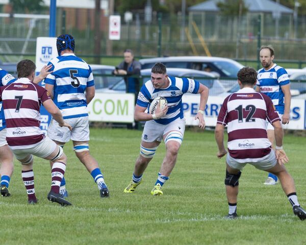 Athy try-scorer, Kevin Downey eyes a gap in Tullow defensive line. Athy try-scorer, Kevin Downey eyes a gap in Tullow defensive line.