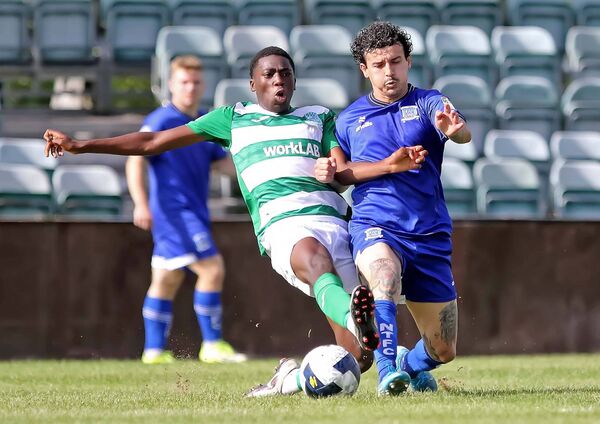 Milton Benitez receives a heavy tackle from Villa’s Anderson Dube. Photo: Noel Browne Milton Benitez receives a heavy tackle from Villa’s Anderson Dube. Photo: Noel Browne