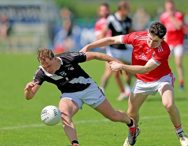 Maynooth's Cathal McCabe and Athy's Padraic Spillane fight for the ball during the 2024 Championship meeting between the clubs, Athy won 1-24 to 3-16. Photo: Sean Brilly Maynooth's Cathal McCabe and Athy's Padraic Spillane fight for the ball during the 2024 Championship meeting between the clubs, Athy won 1-24 to 3-16. Photo: Sean Brilly