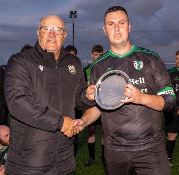 Bernard Mullen (vice chairman CDFL) presents the KCLR plate to Mill Celtic captain Brian Mackey Bernard Mullen (vice chairman CDFL) presents the KCLR plate to Mill Celtic captain Brian Mackey