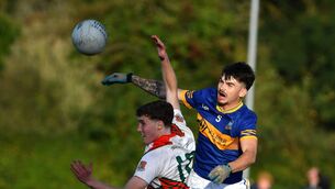 <p>Suncroft's Hugh Martin contests a high ball with Grangenolvin's Keith Holligan. Photo: Michael Anderson.</p>