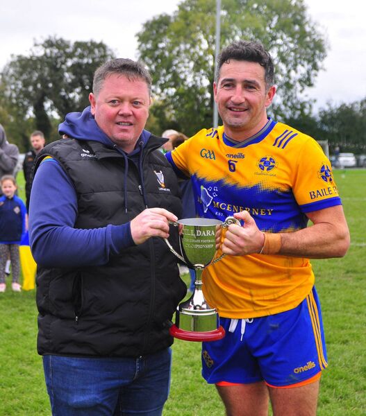 Ger Arnold (Kildare GAA) presents the Intermediate 'A' Championship trophy to Ellistown captain Andrew McLoughlin Photo: Martin Rowe Ger Arnold (Kildare GAA) presents the Intermediate 'A' Championship trophy to Ellistown captain Andrew McLoughlin Photo: Martin Rowe