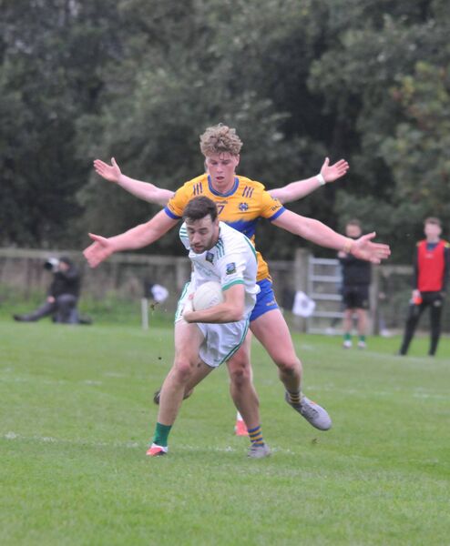 Nurney's Jessie Moore had no chance here as the four arms (!) of Darragh Watson closed him down Photo: Martin Rowe Nurney's Jessie Moore had no chance here as the four arms (!) of Darragh Watson closed him down Photo: Martin Rowe