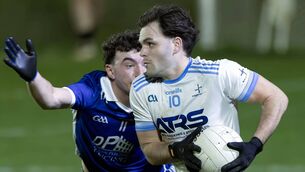 <p>Athgarvan's Cian Doyle bursts past the challenge of Robertstown's Aidan Gillen. Photo: Sean Brilly</p>