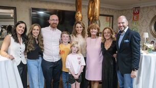 <p>Bridie Corrigan with her family at the party in the Clanard Court Hotel to celebrate her 40 years as a childcare provider Photos: Aisling Hyland</p>