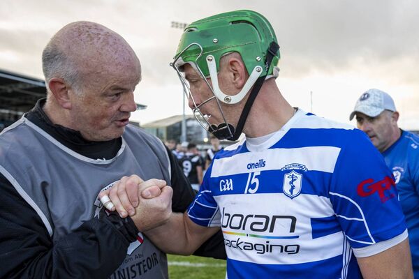 Maynooth manager Ollie Baker congratulates Jack Sheridan after the game Maynooth manager Ollie Baker congratulates Jack Sheridan after the game