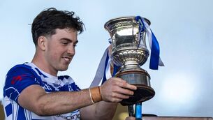 <p>Naas captain Conan Boran with the Tony Carew Cup</p>
